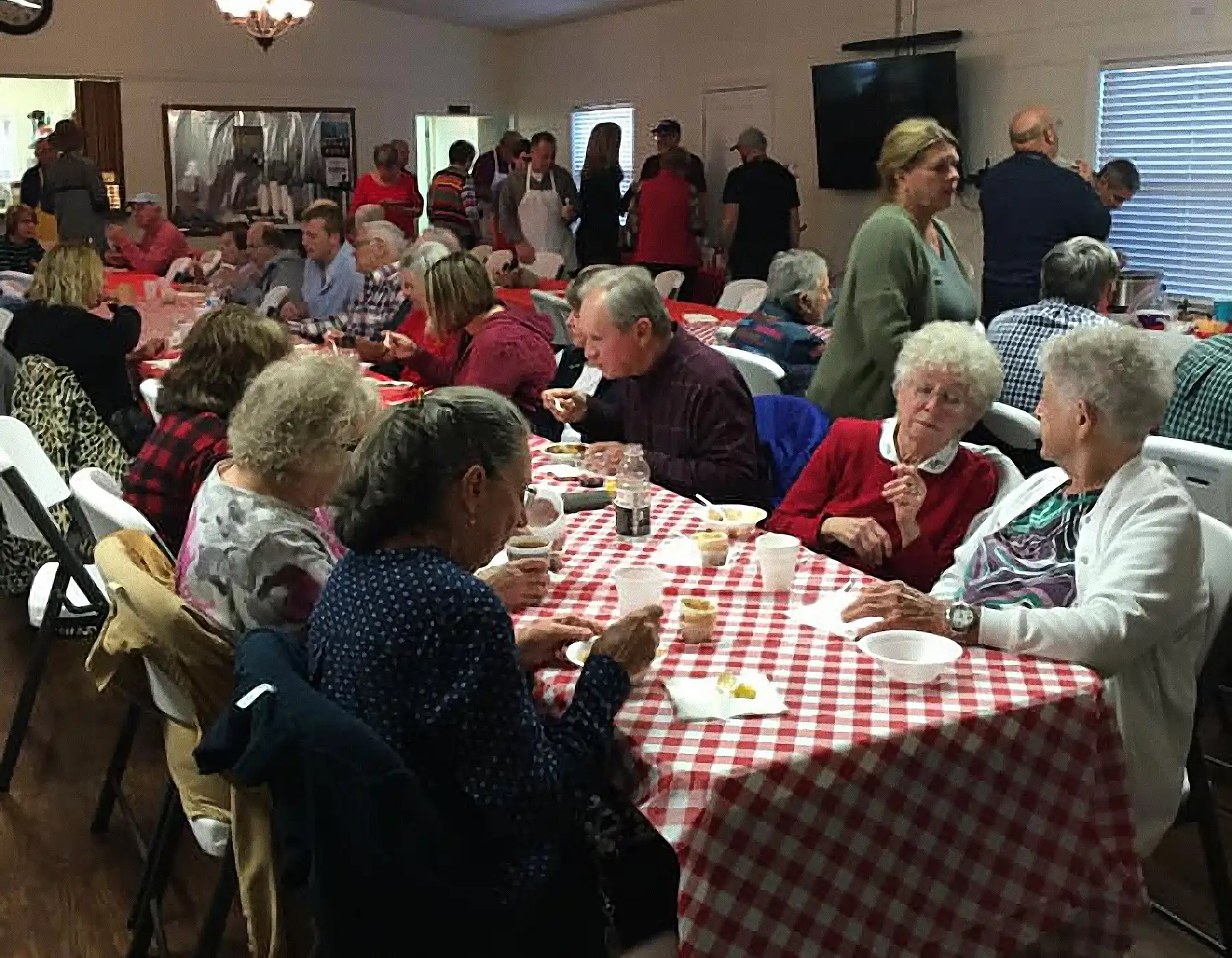 Group tasting and enjoying chili